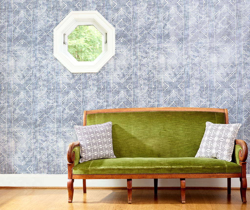 Geometric wallpaper feature wall with vintage velvet couch, Holli Zollinger