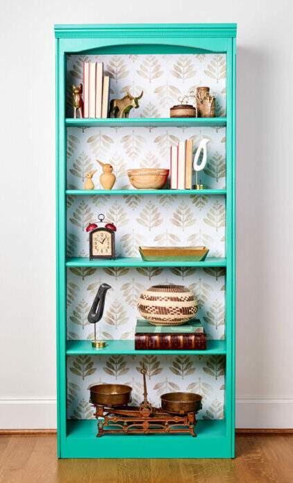 Bookcase makeover with wallpaper and paint