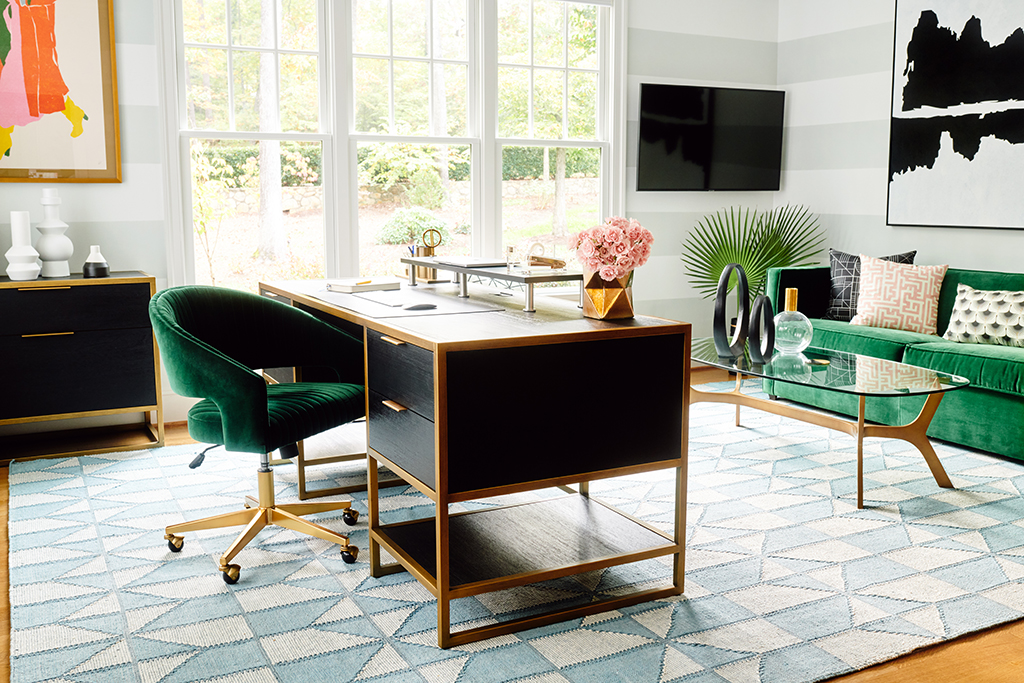 Strong blacks, gold accents and green velvet lend hollywood regency style to this home office