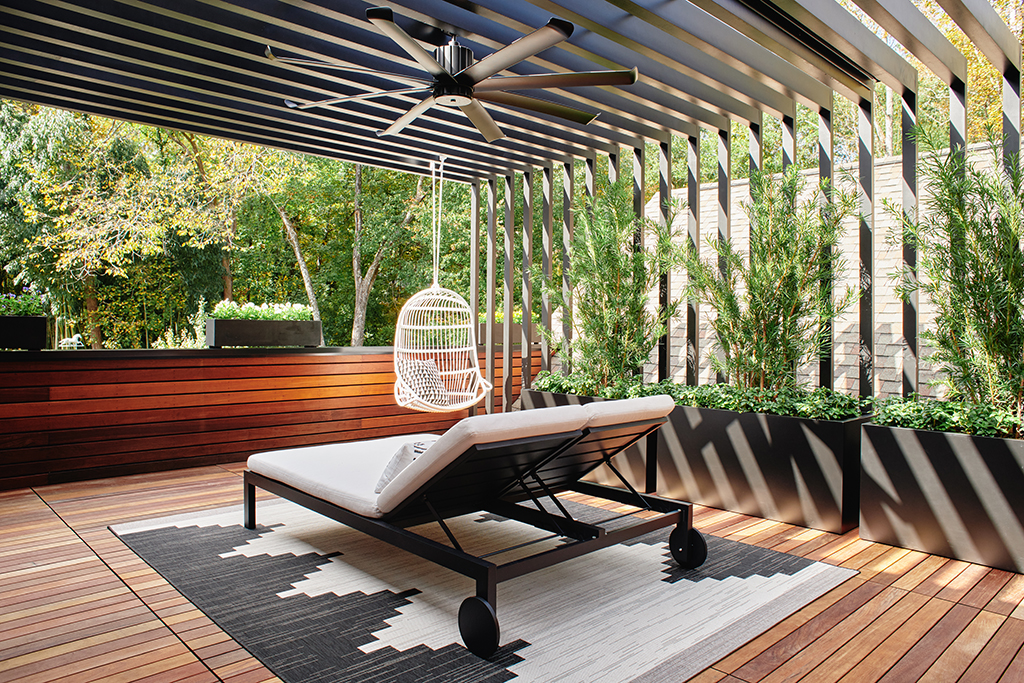 Rooftop Spa Deck featuring ipe walls and floor tiles, black metal pergola, hanging chair Serena & Lily