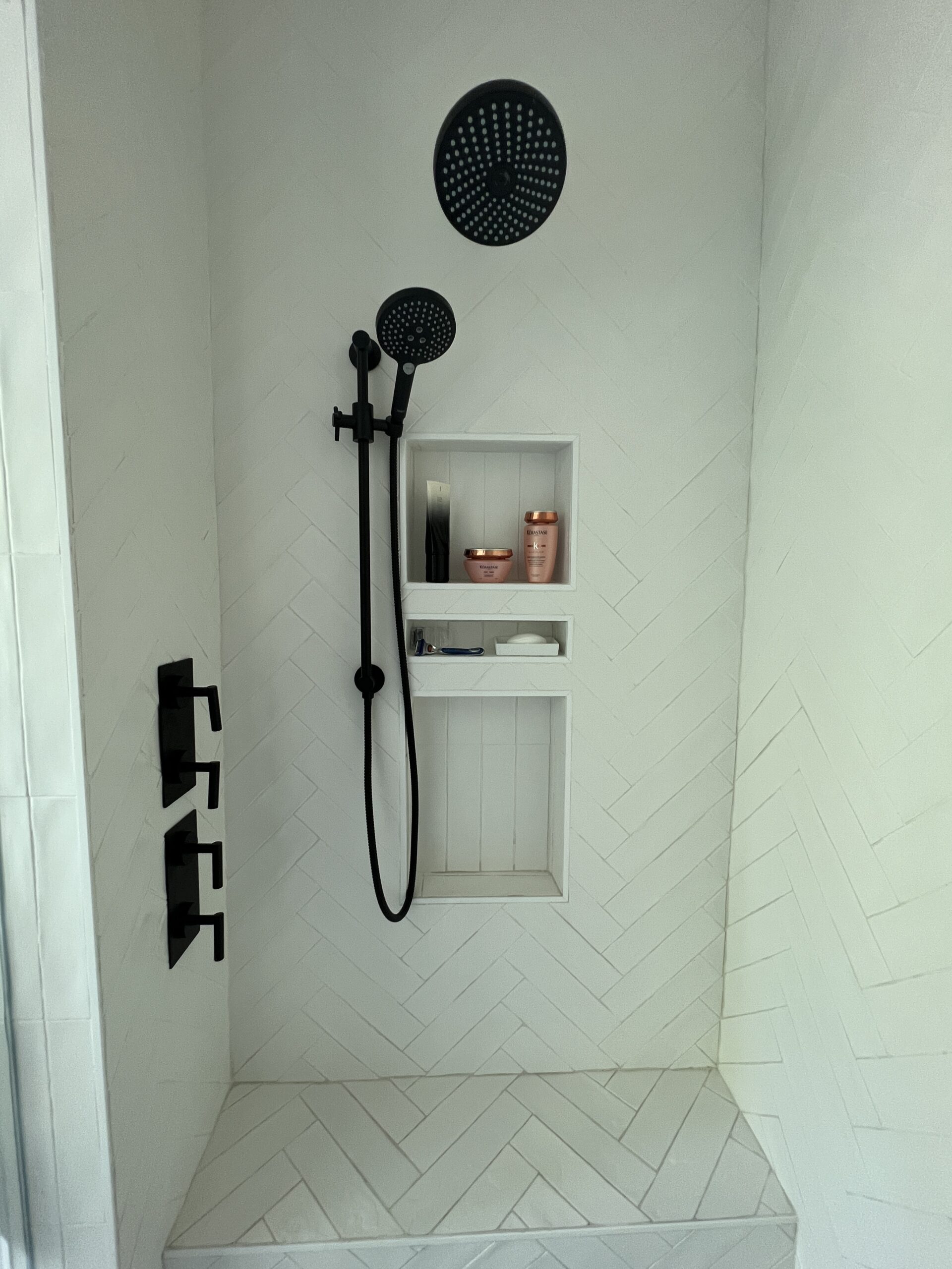 Herringbone matte white tile in shower