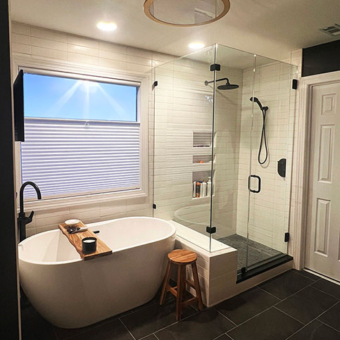 High contrast, white and gray primary bathroom