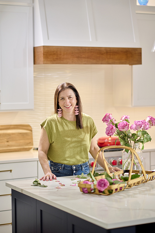 Allison Sloan Polish in client's home arranging flowers